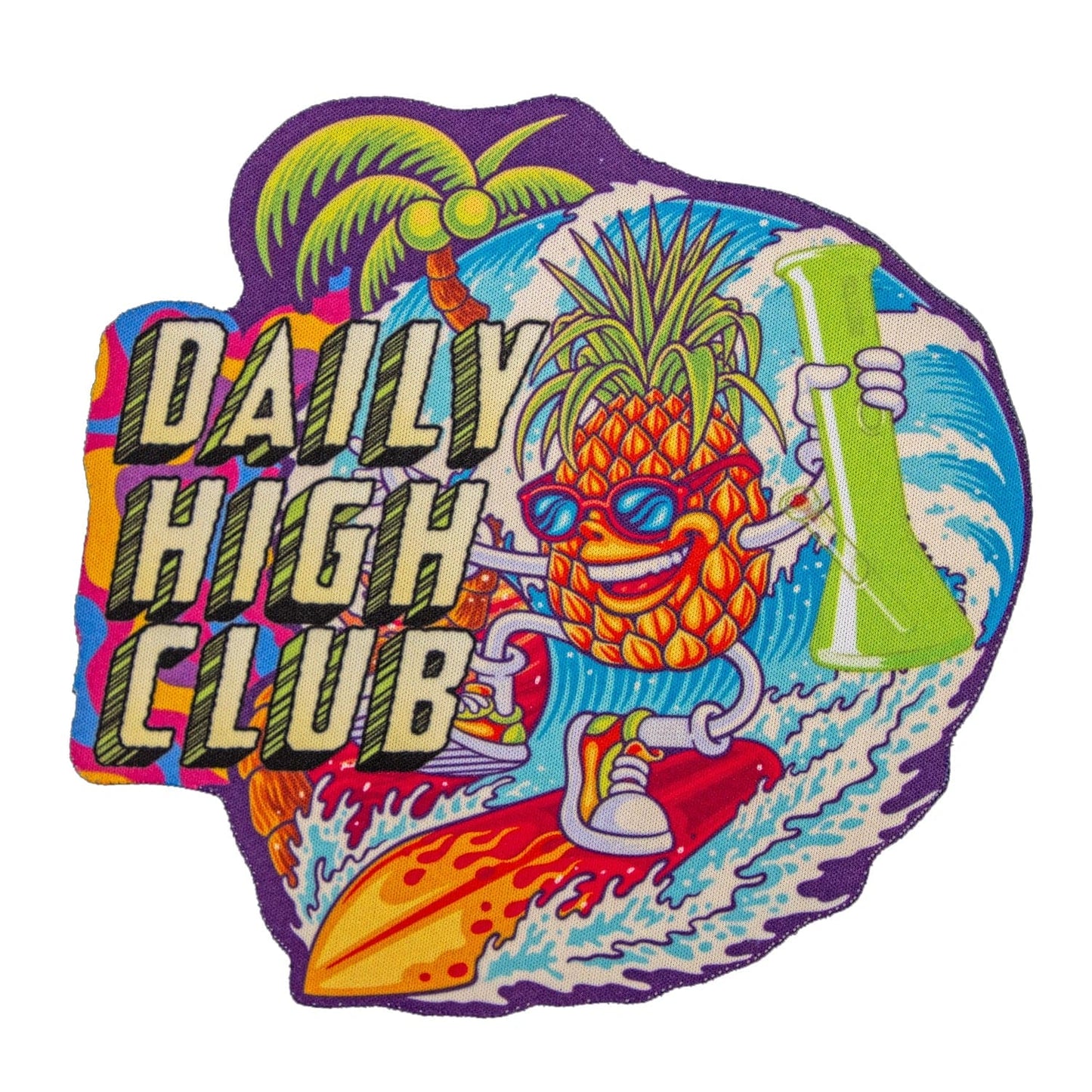 A vibrant, cartoon-style image of the Cowabunga Pineapple Dab Mat featuring a dabbing pineapple against a blue and white wave backdrop.