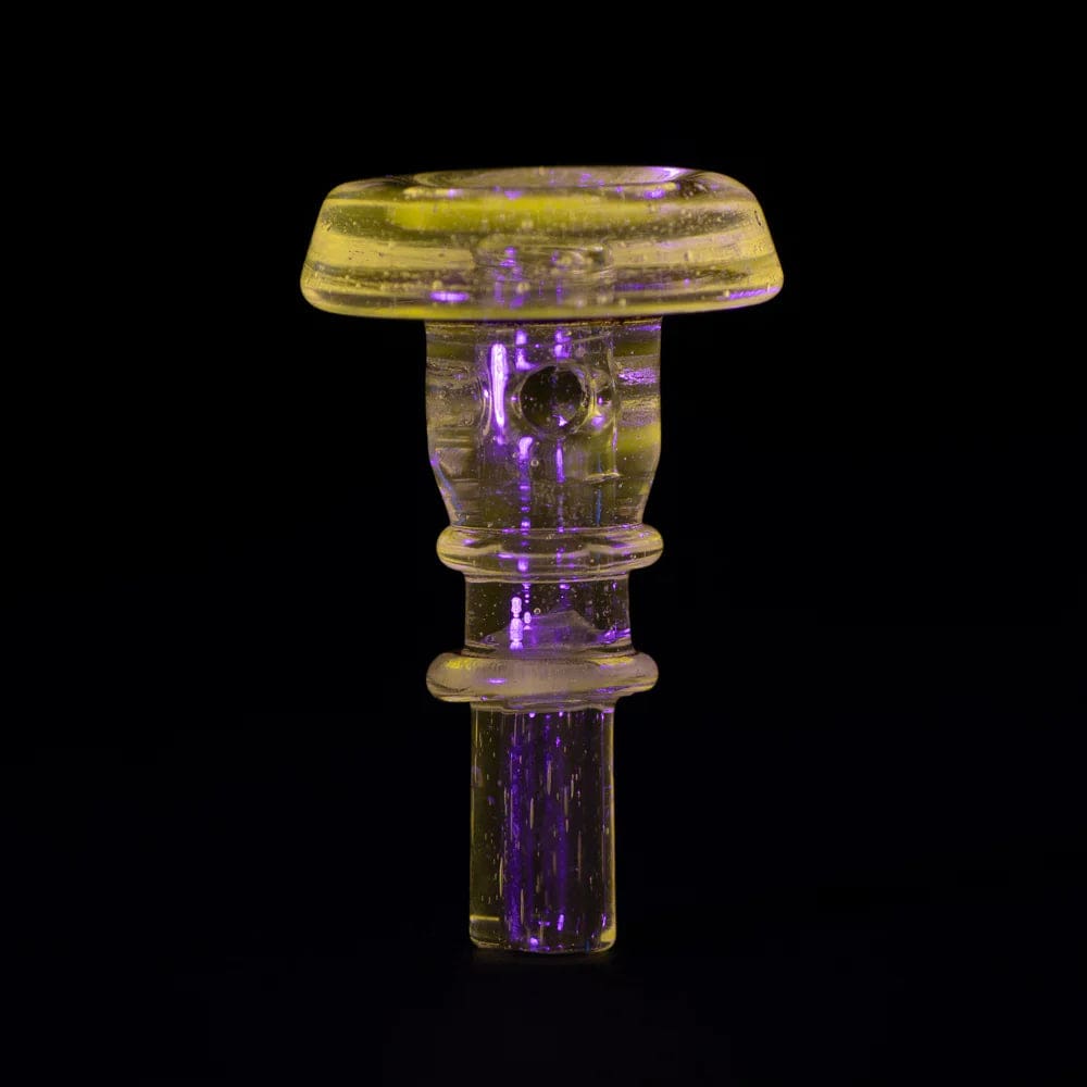 Close-up shot of the PuffCo Peak Pro 3D XL Chamber Glass Joystick Cap, displaying its clear glass construction and joystick-style top.