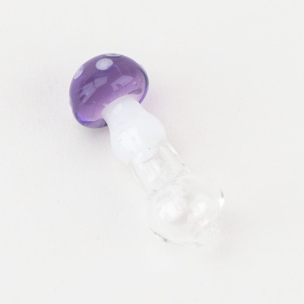 A close-up, angled view of the Sriusly Shrooms PuffCo Peak Pro Glass Ball Cap, showcasing its polished purple surface.
