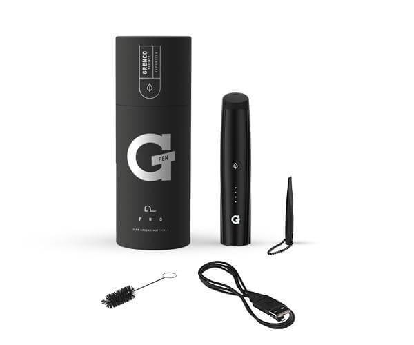 A studio shot displays the G Pen Pro Vaporizer with its charging cable and cleaning tool arranged next to its branded packaging.