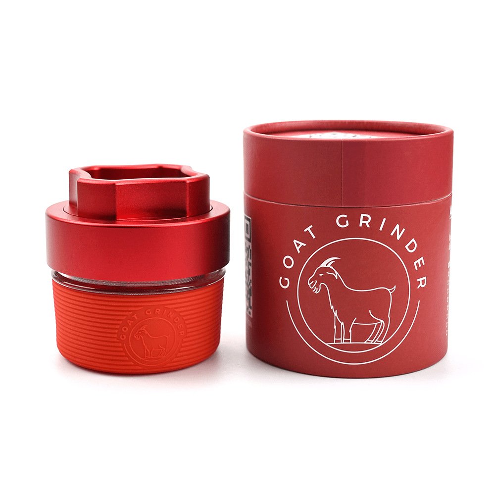 Front view of the AITH v.I – OG Grinder Jar, a red, cylindrical container with a tightly sealed lid.