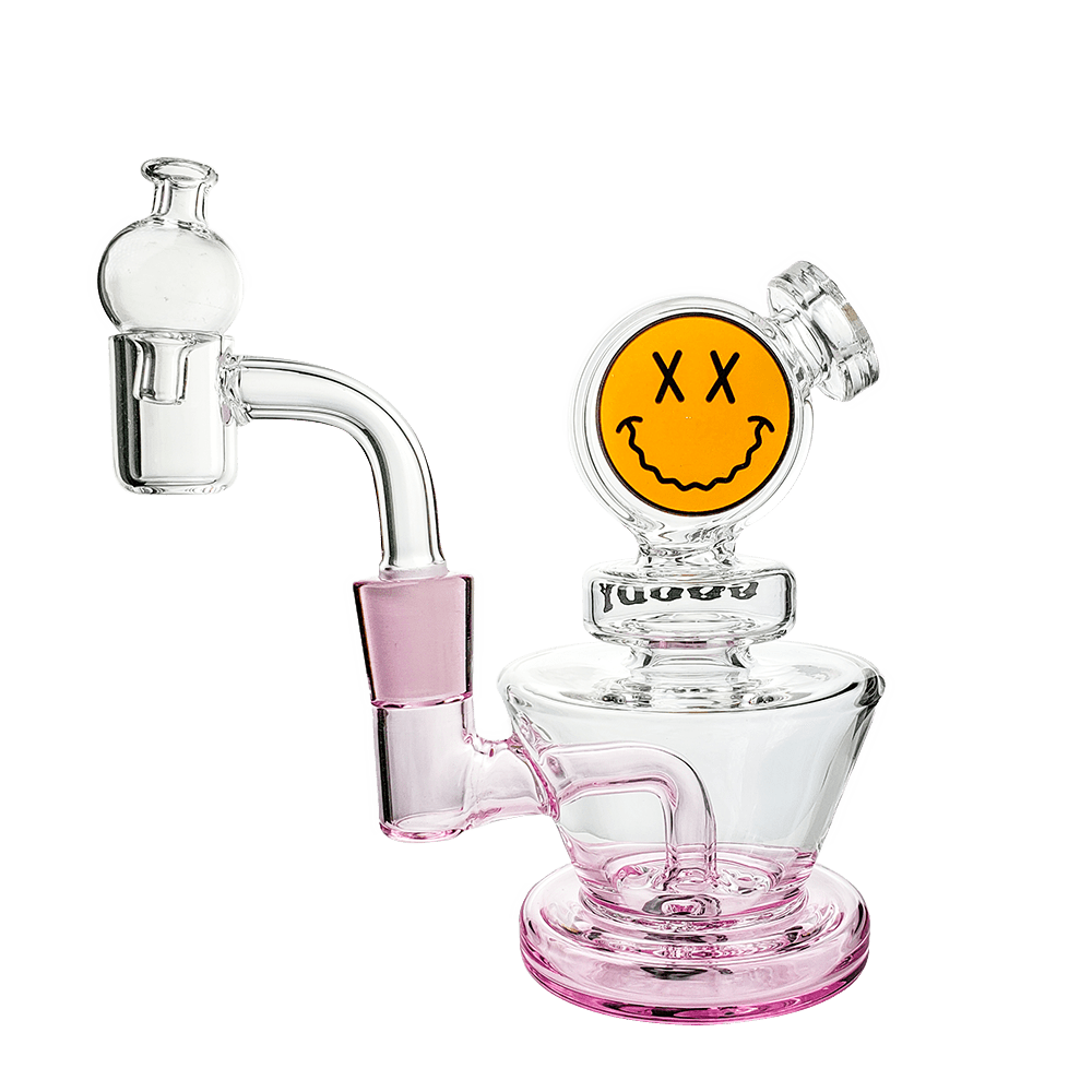 A close-up, angled view of the Big Face Mini Rig 4-Piece Kit, showcasing its clear glass construction and unique facial design.