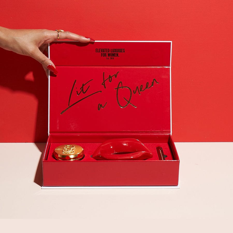 A hand opens the “Get Lit Kit” box, revealing a red interior against a matching red backdrop.