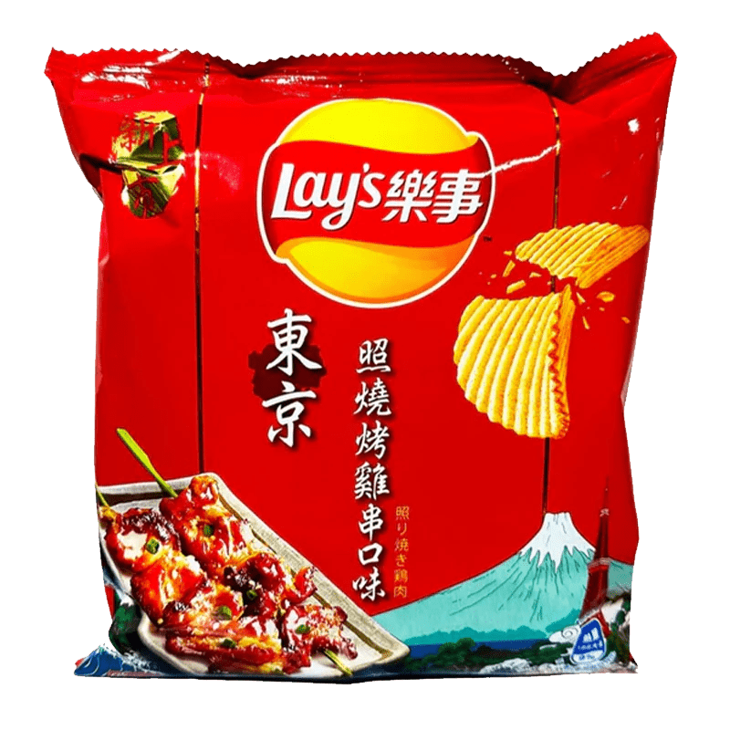 A close-up, angled view of Lay’s Chips - Yakitori Grilled Chicken packaging with a photo of the chips on the front.