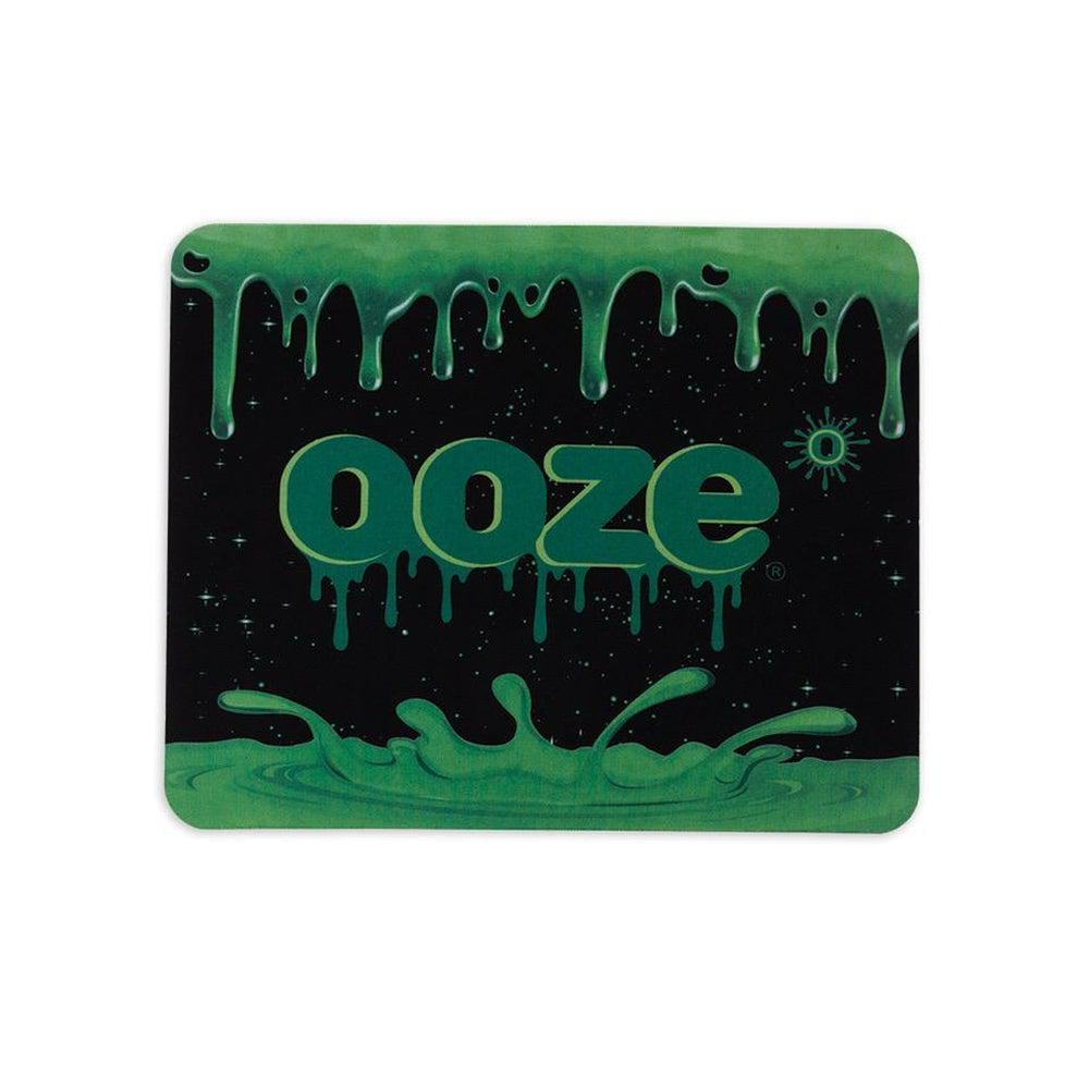 The Ooze Mouse Pad displays a dark, textured background with a vibrant, dripping effect across the top.
