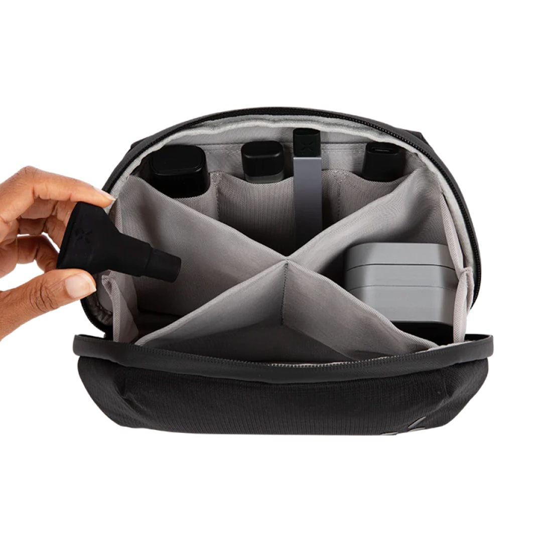 An open PAX Smell Proof Bag reveals a black, segmented interior, viewed from above and slightly angled.
