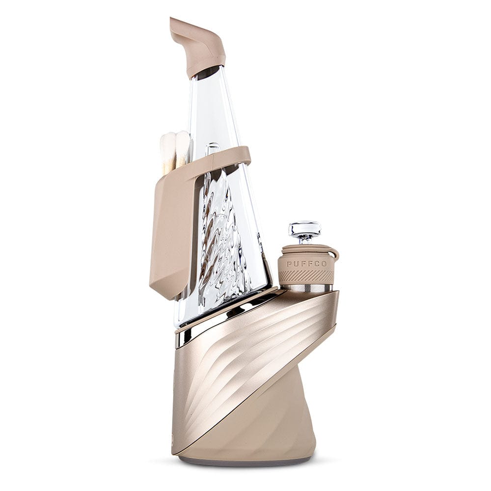 A three-quarter view of the Puffco Peak Pro Travel Pack V2 Desert LE, showcasing its streamlined design and metallic finish.