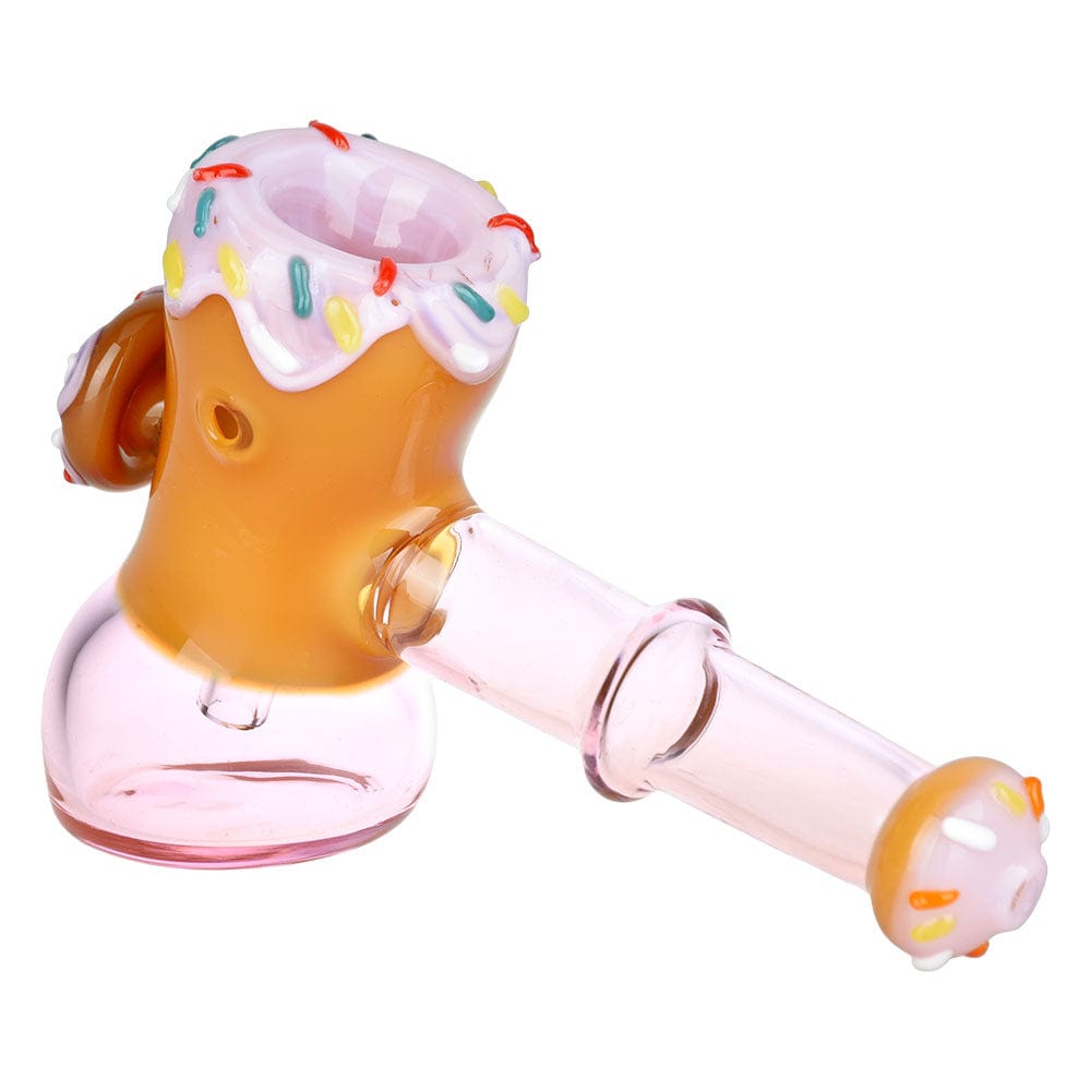 A three-quarter view of the Donut Hammer Bubbler, featuring a rounded glass bowl resembling a frosted donut.