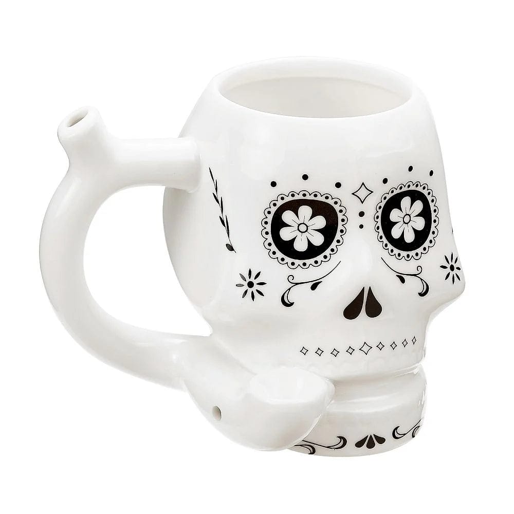 A studio shot of the Sugar Skull Pipe Mug, featuring a white ceramic mug decorated with a colorful skull design.