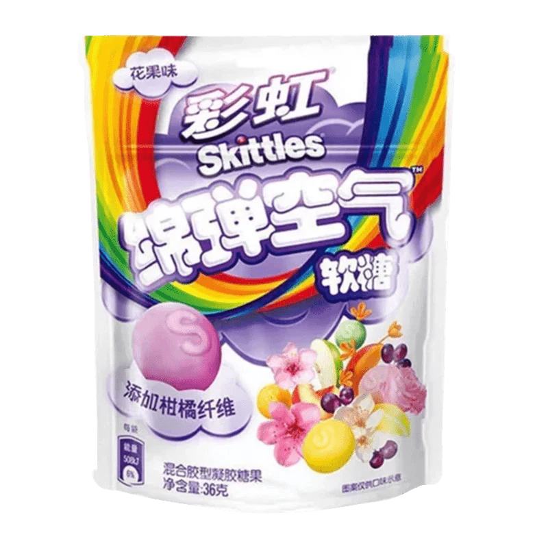 A front view of Skittles - Clouds Fruit and Flower Gummies packaging, featuring colorful fruit and flower illustrations.