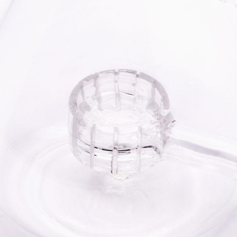 An angled view of the Exo Stem Beaker, showcasing its clear glass construction and simple, cylindrical shape.