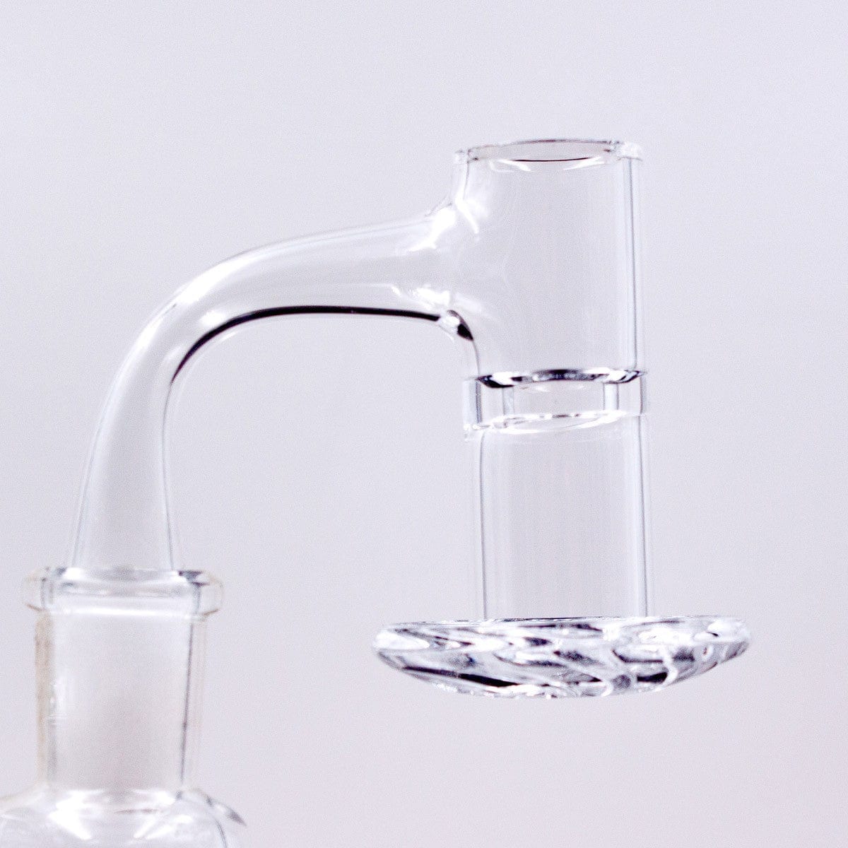 A close-up, angled view of the Full Weld Straight Blender Slurper Quartz Banger, showcasing its clear glass construction.