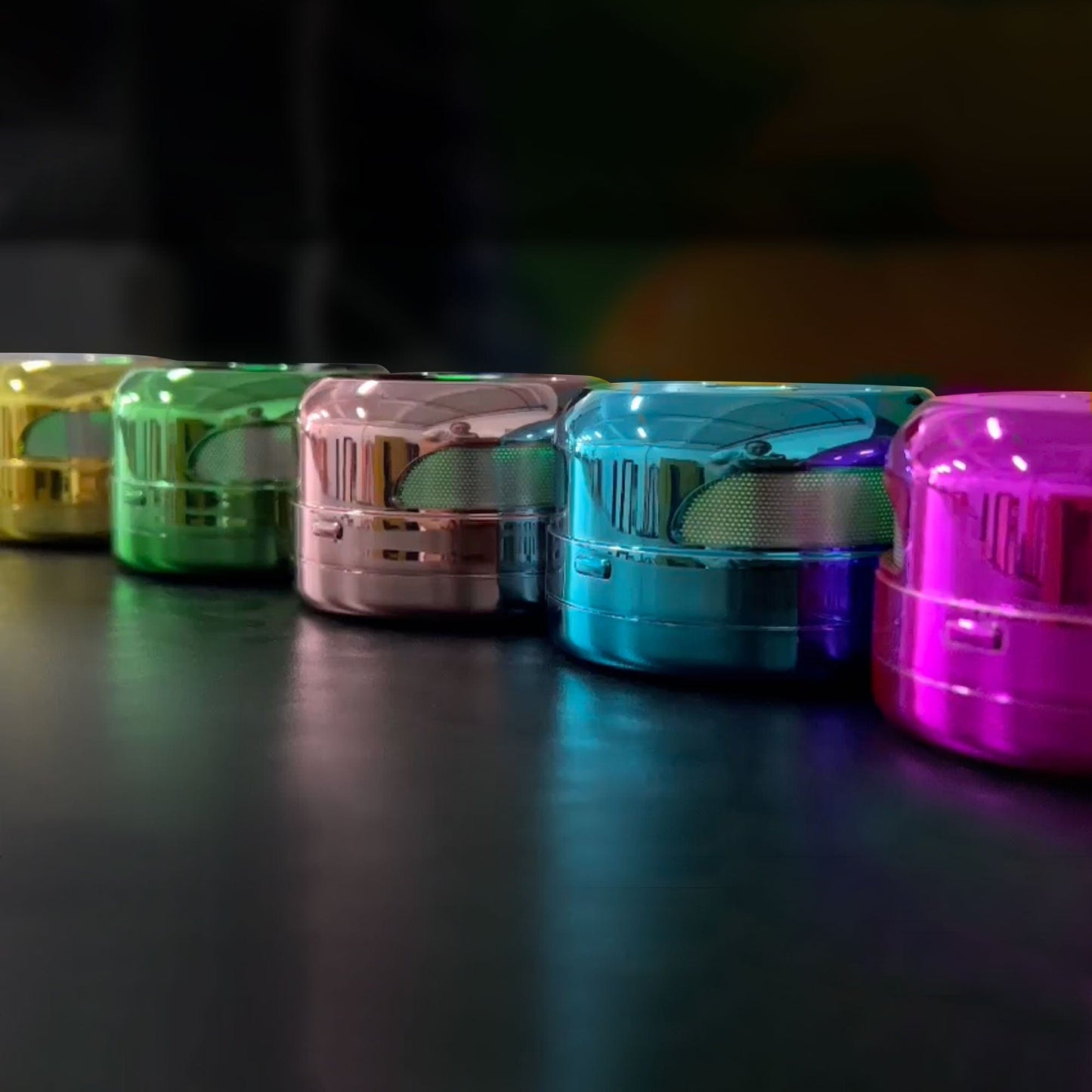 A low-angle studio shot features the UFO Induction Heater, its sleek metallic form illuminated against a dark reflective background.