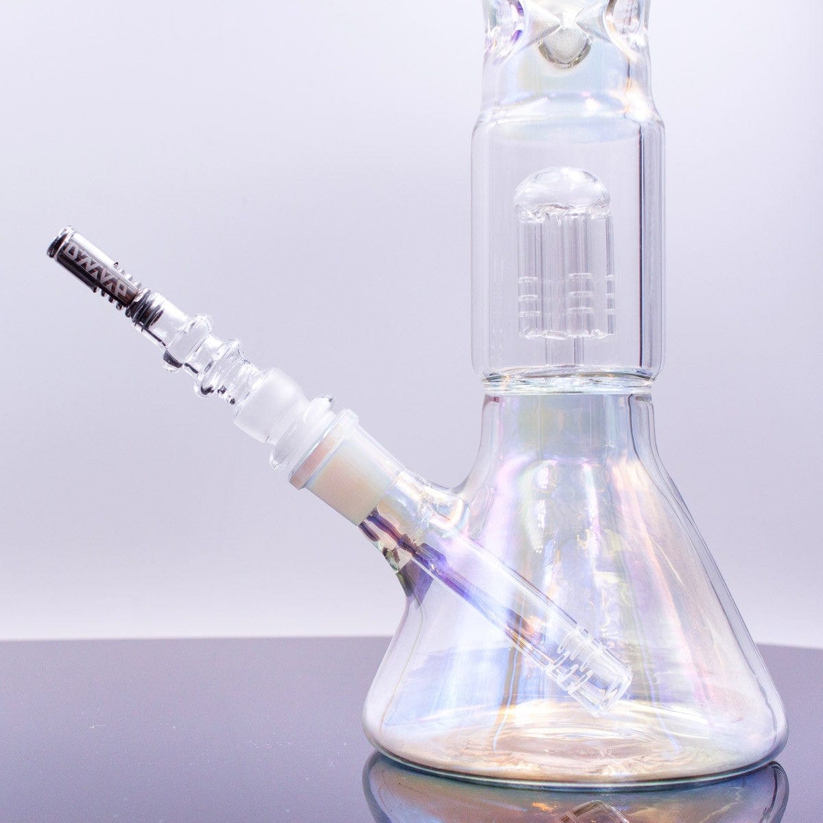 A close-up, angled view of the Universal Glass Adapter for DynaVap, showcasing its clear glass construction and seamless connection.