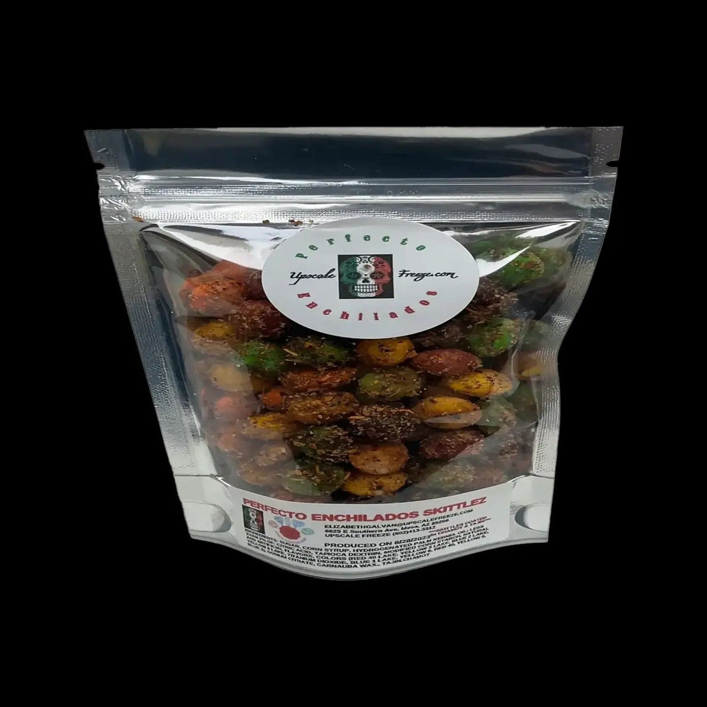 A close-up shot of the Upscale Freeze Perfecto Enchilado Skittles in a clear plastic bag against a dark background.