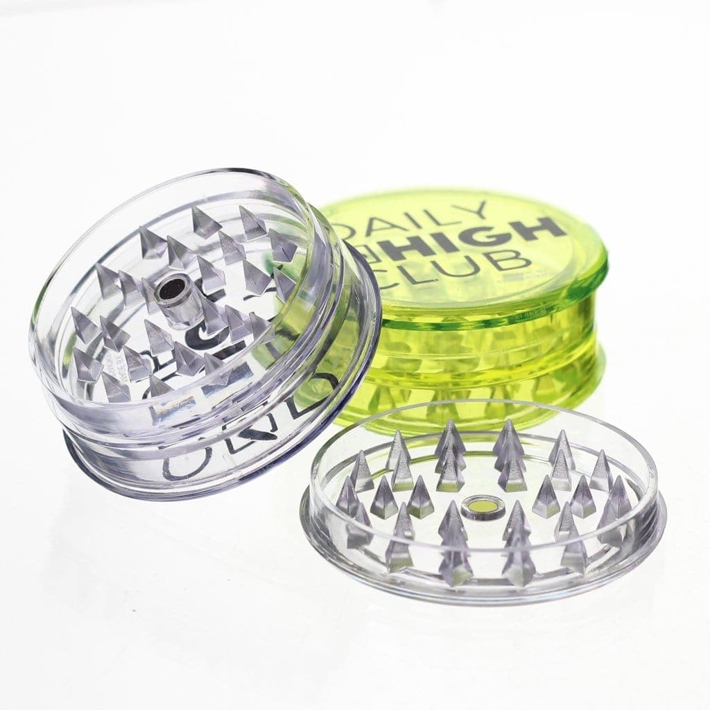 A close-up, angled view of the 3-Piece Acrylic Grinder, showcasing its clear, multi-tiered construction.