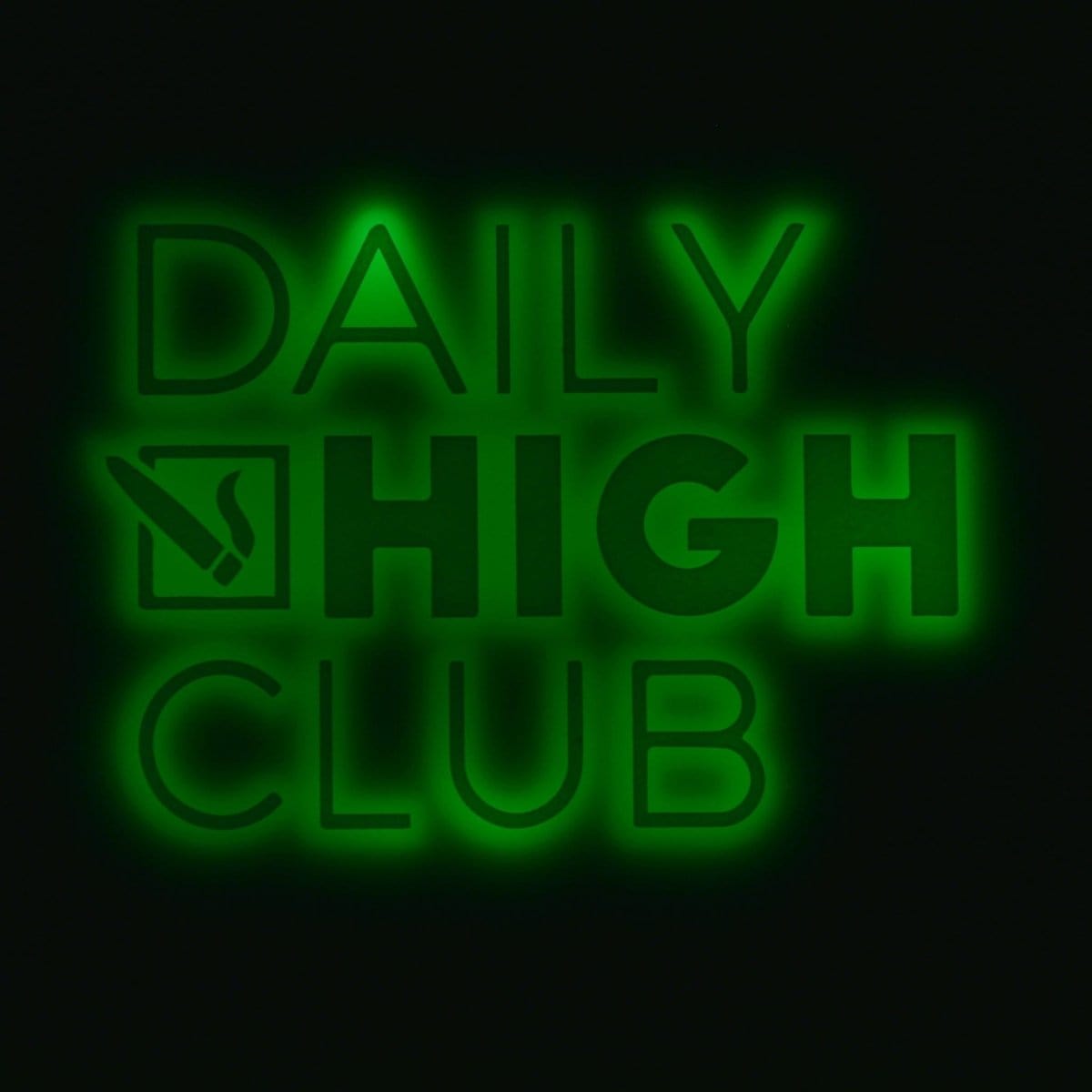 Overhead view of the GlowTray x Daily High Club Rechargeable LED Rolling Tray, illuminated with a soft glow on a dark surface.