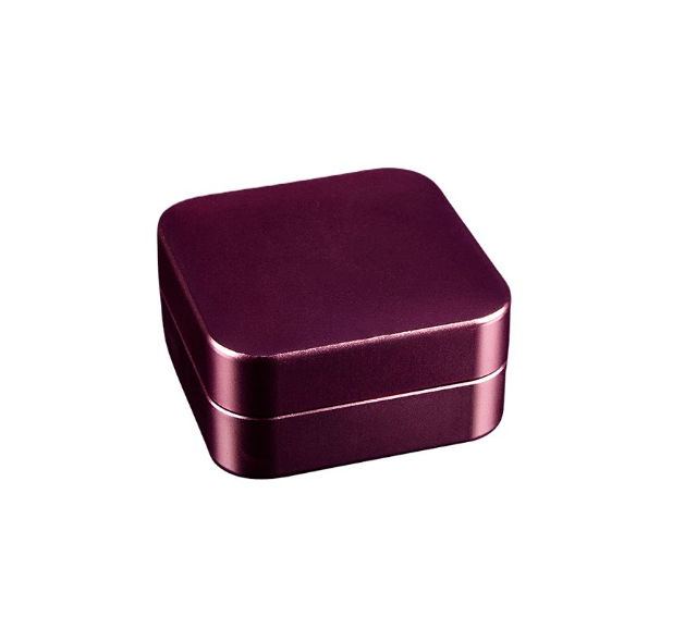 A top-down view of the 2 Piece Aluminum Square Grinder, showcasing its polished, square shape and two-part construction.