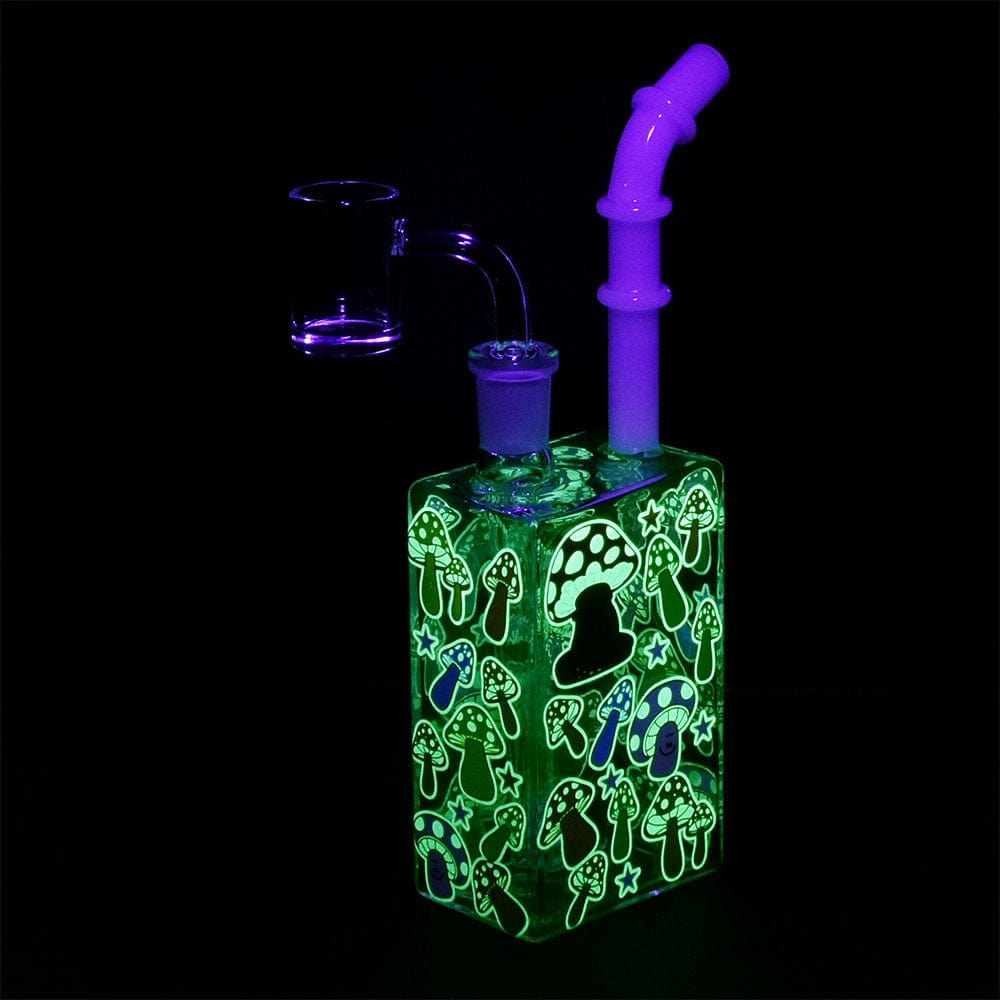 Front view of the Glow Mushroom 7.5" Juice Box Dab Rig, illuminated with a vibrant, glowing green design.