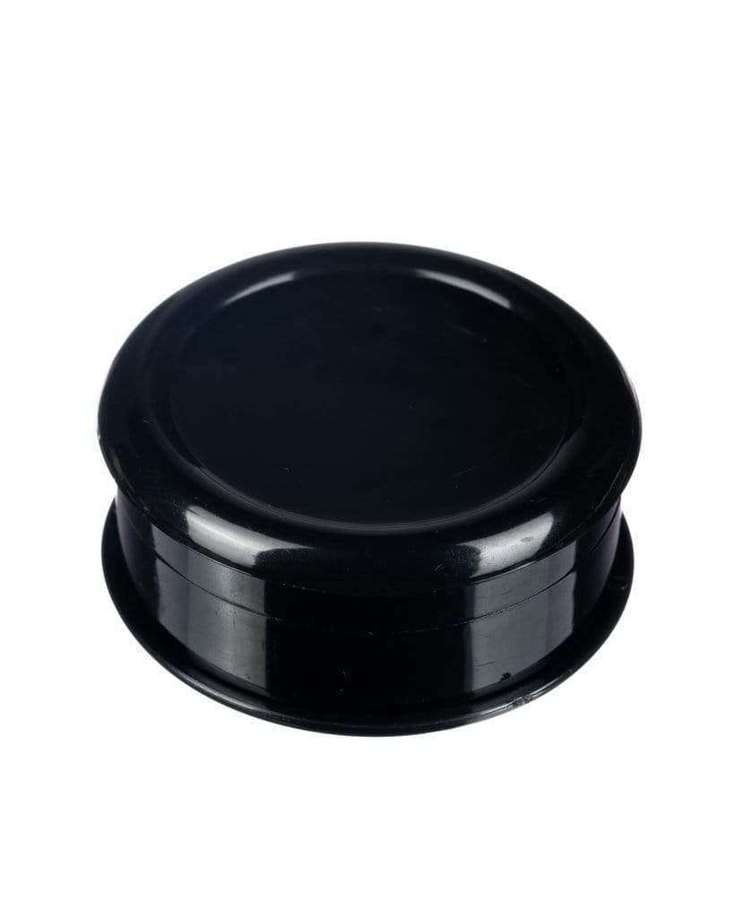 Top-down view of the Travel Herb Grinder & Stash Jar, showcasing its circular, dark-colored design against a plain white background.