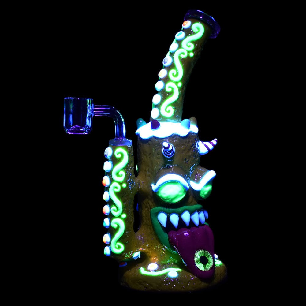 A studio shot of the Gingerbread Monster Dab Rig, featuring a colorful, monster-themed design and a visible 14mm joint.