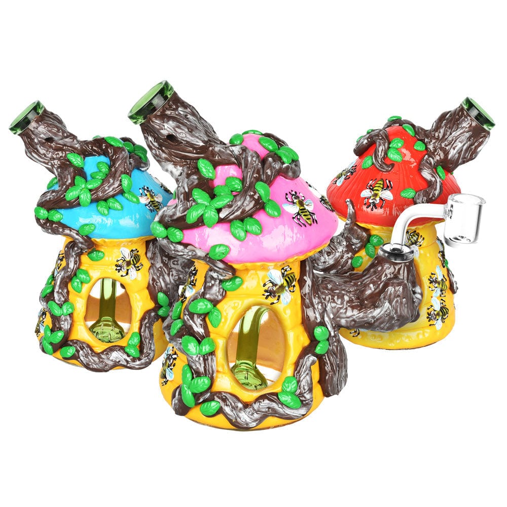 Front view of the Symbiotic Beehive Dab Rig, a colorful, sculpted glass piece resembling a beehive with visible bubbling details.