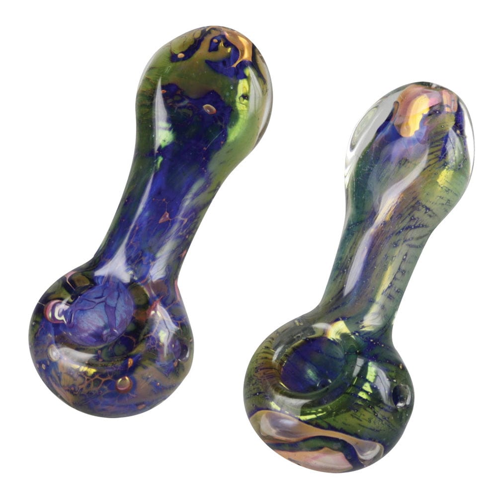 A side view of the Spattered Fumed Spoon Pipe, displaying its colorful, speckled glass construction and curved shape.