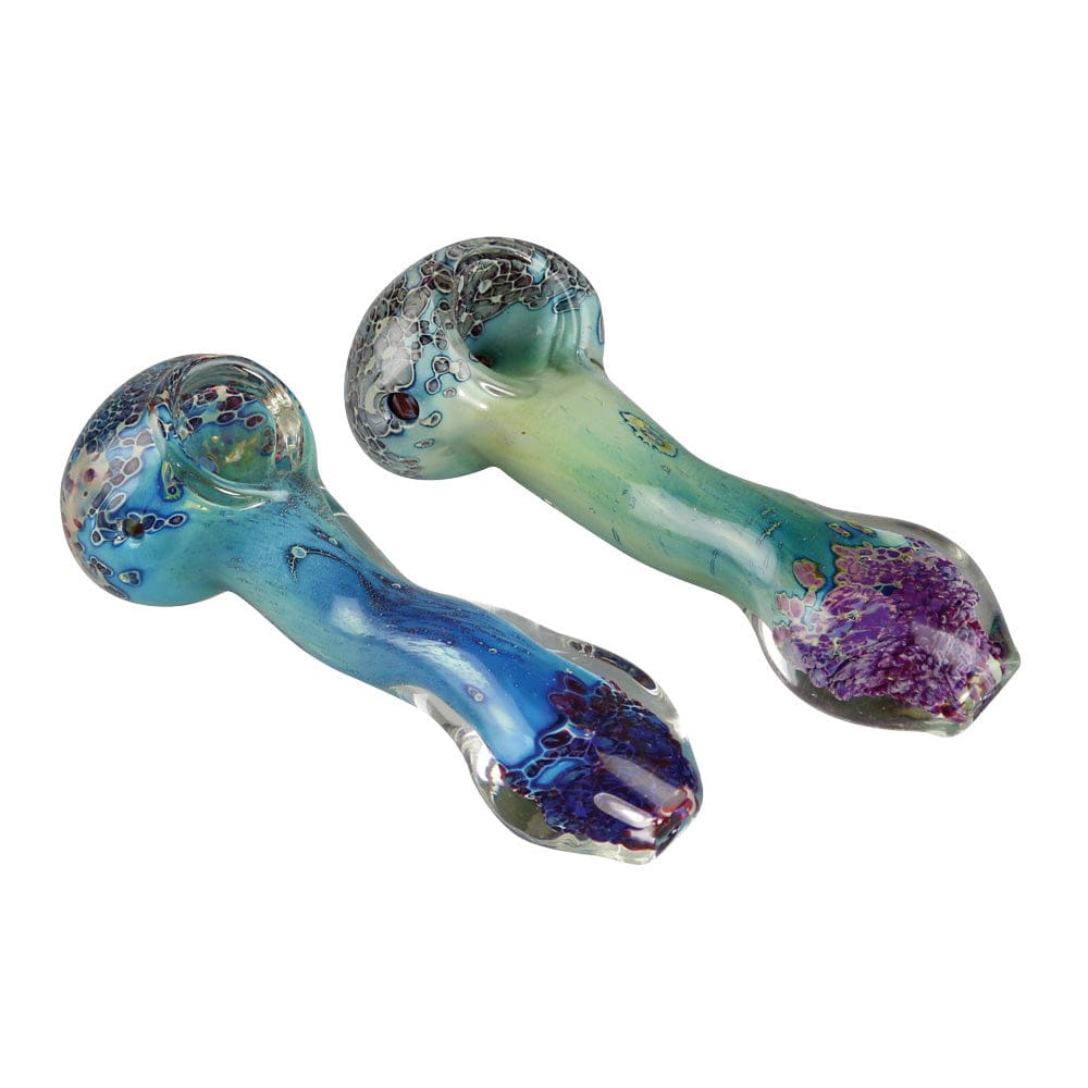 A close-up, angled view of the Silver Fumed Glass Spoon Pipe, showcasing its curved shape and dark silver fume detailing.