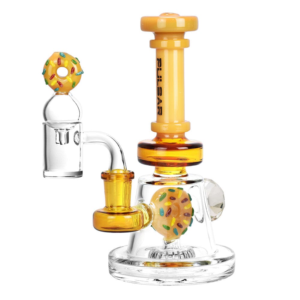A three-quarter view of the Pulsar Donut Diamond Dab Rig Set, showcasing its colorful, stacked glass design and small size.