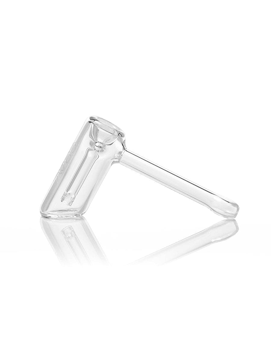A side view of the GRAV® Mini Hammer Bubbler, showcasing its compact clear glass design against a stark white background.
