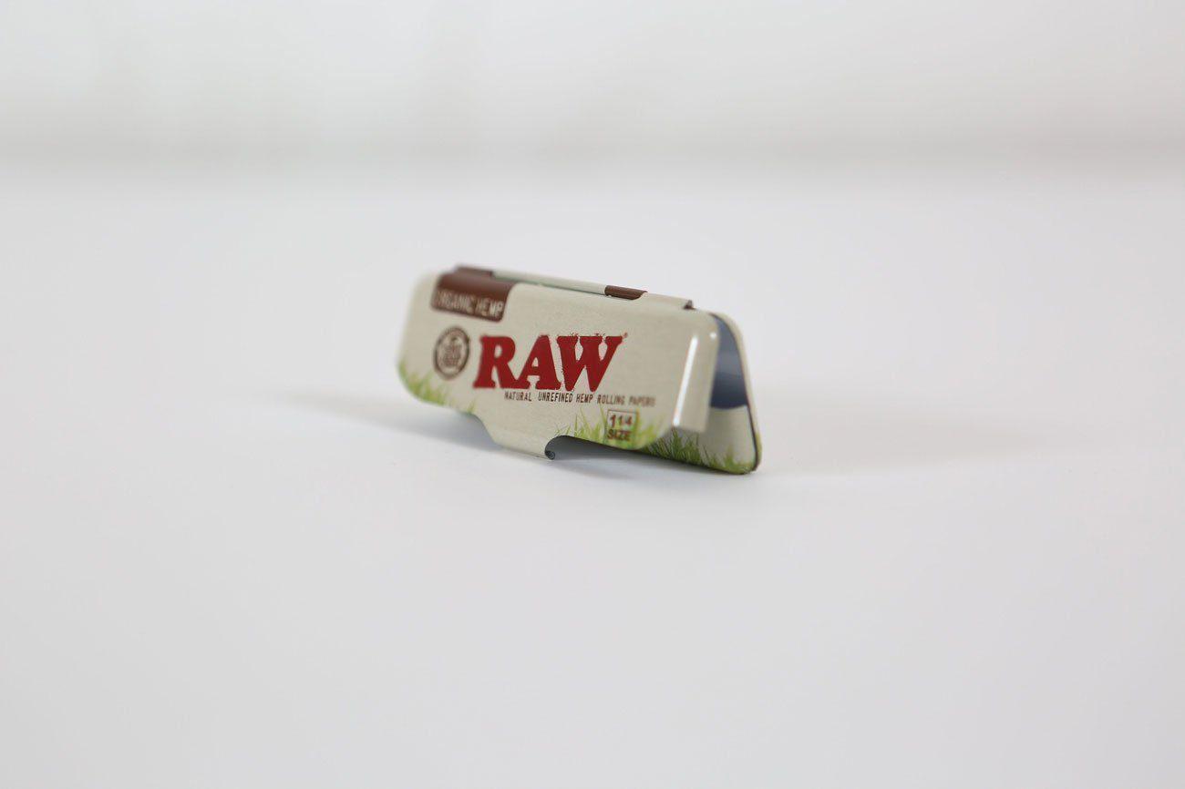 A close-up shot of the Raw Paper Tin with branding visible, sitting against a neutral background.