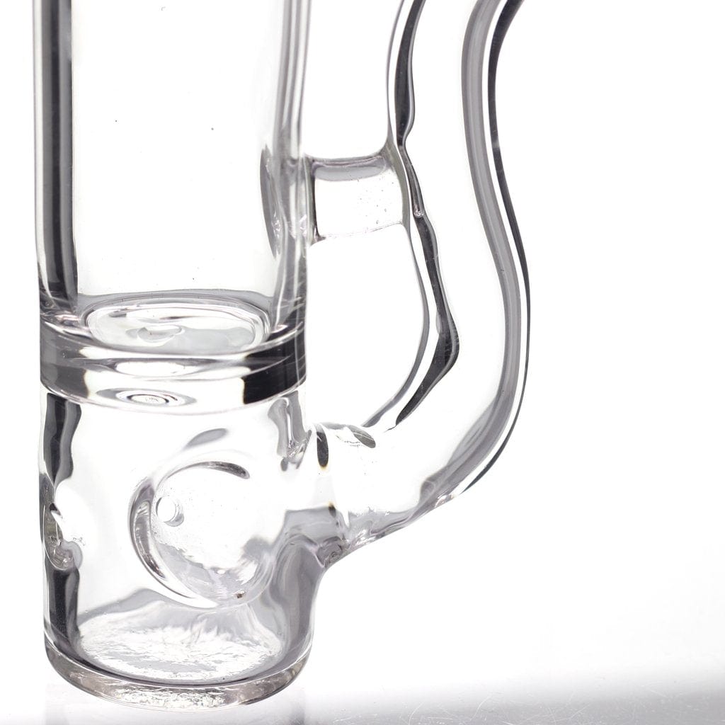 A close-up, angled view of the Shot Glass Pipe, showcasing its clear glass construction and simple curved form.