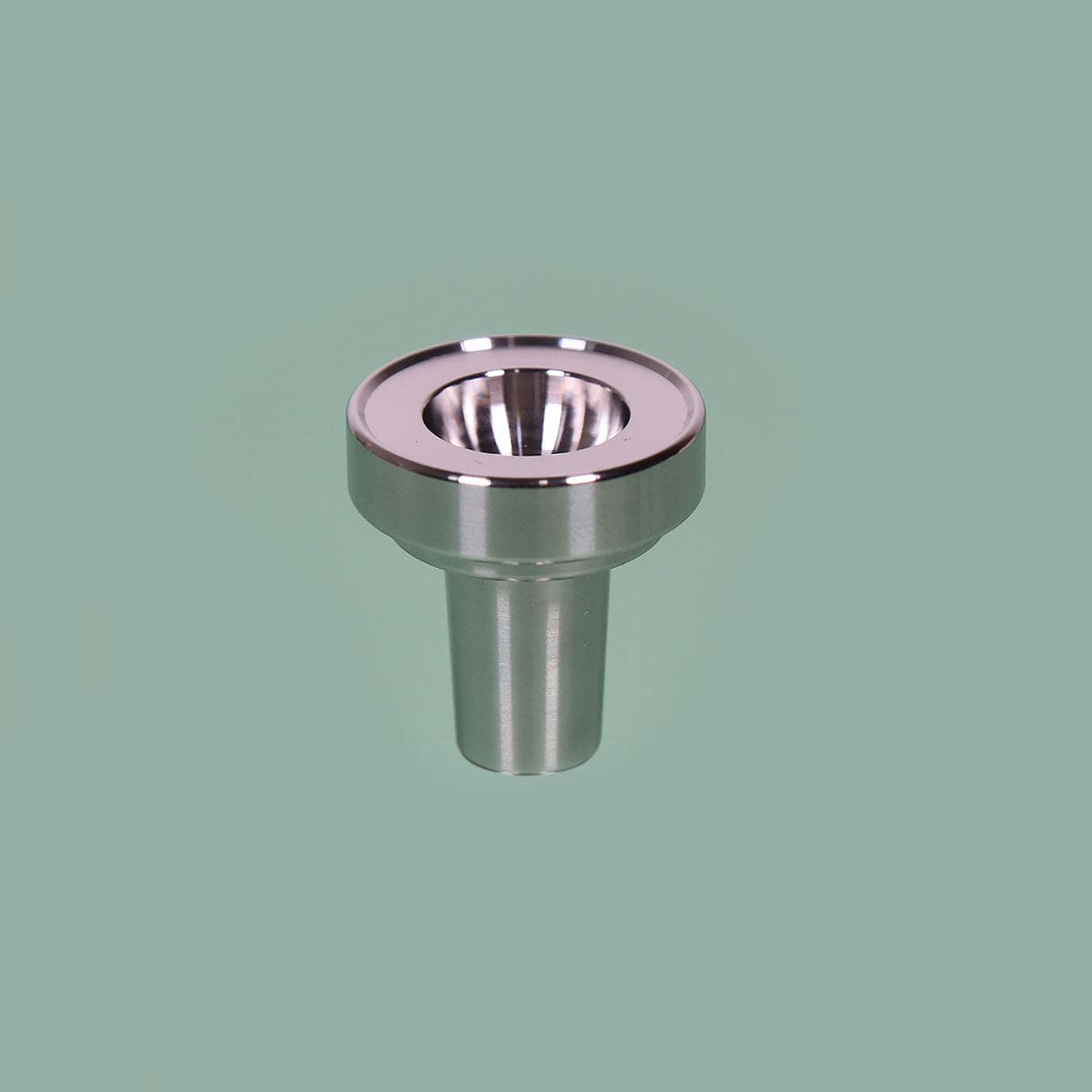 A close-up, angled view of the Stainless Steel Bowl Piece, showing its polished metal construction and rounded shape.