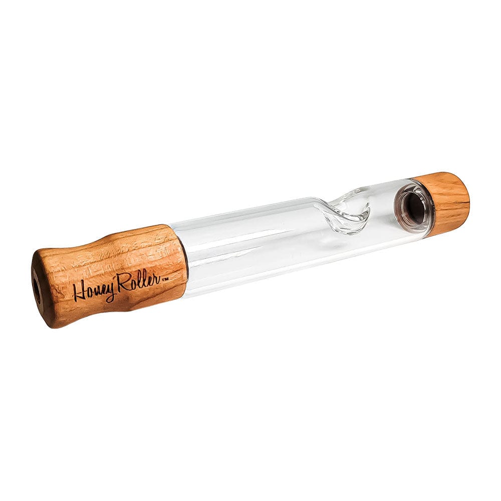 A close-up, angled view of the Honey Labs Honey Roller Steamroller, showing its clear glass construction and simple cylindrical shape.