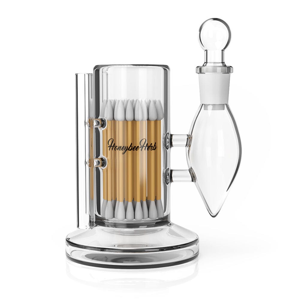 The Deluxe Iso Station is pictured in a front view, holding multiple cotton swabs inside its clear glass container.