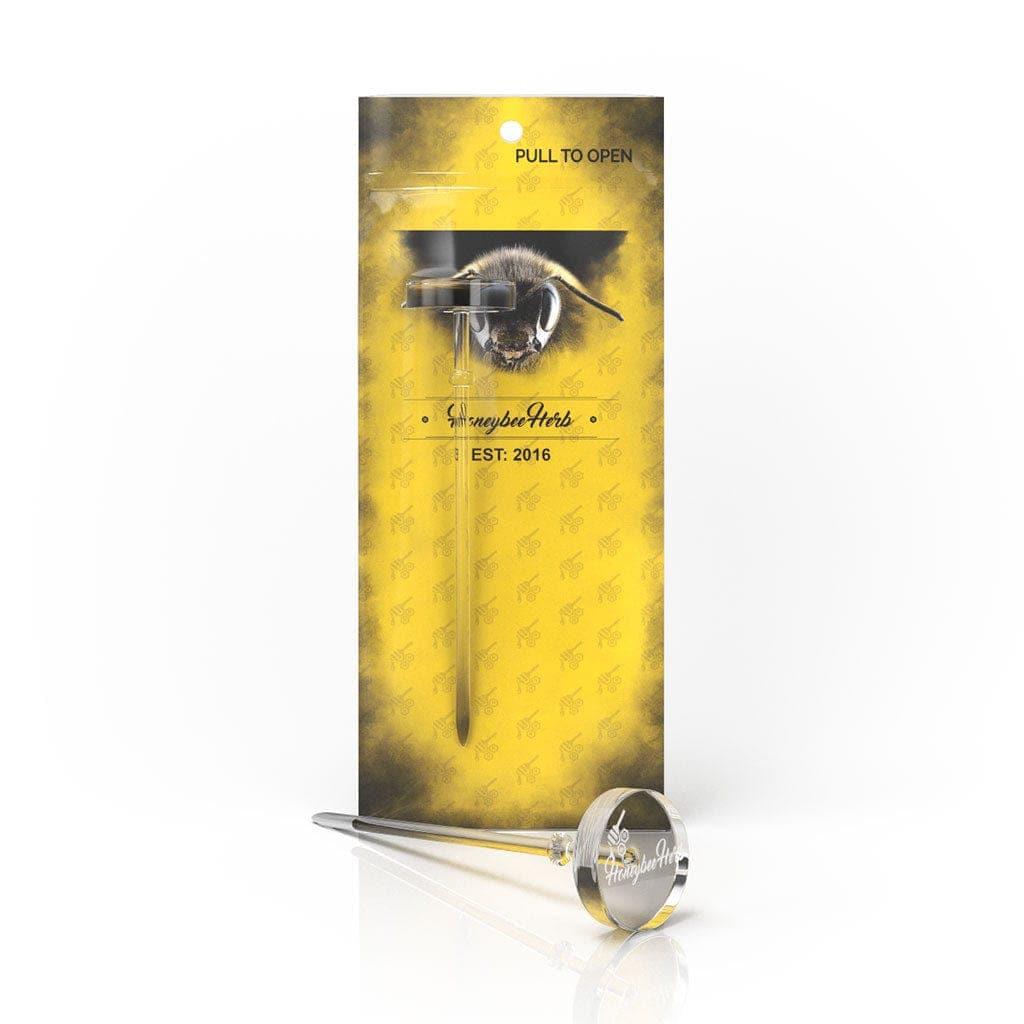 Front view of the Honeybee Herb Flat Top Dabber & Carb Cap Tool in its packaging, highlighting the product's silhouette.