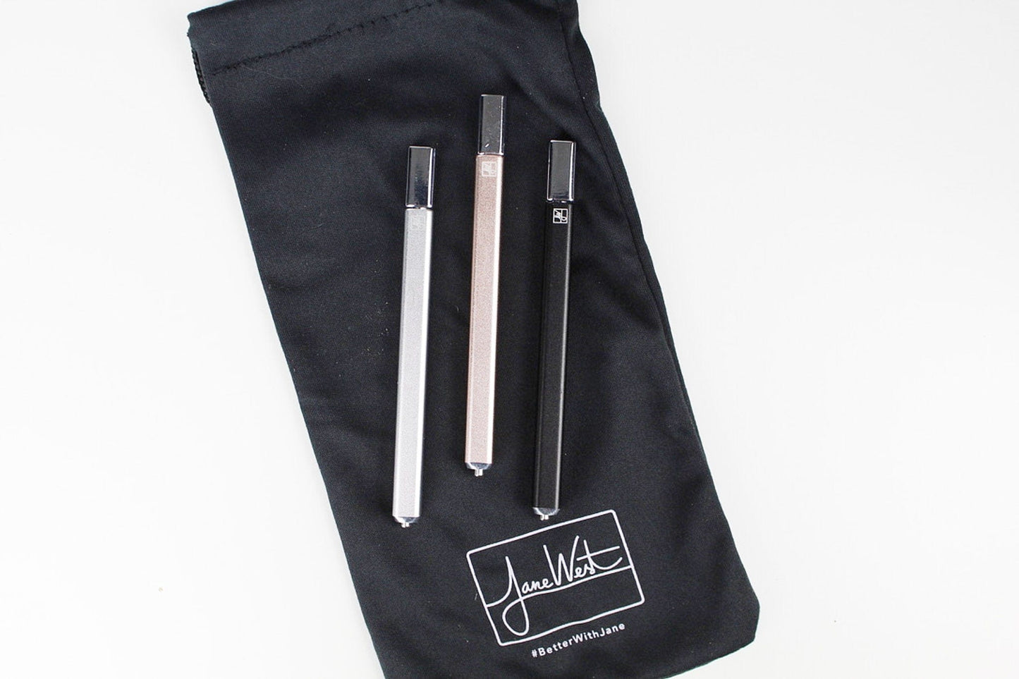 Front view of The Trio, showcasing three sleek, clear glass pieces arranged vertically on a dark background.