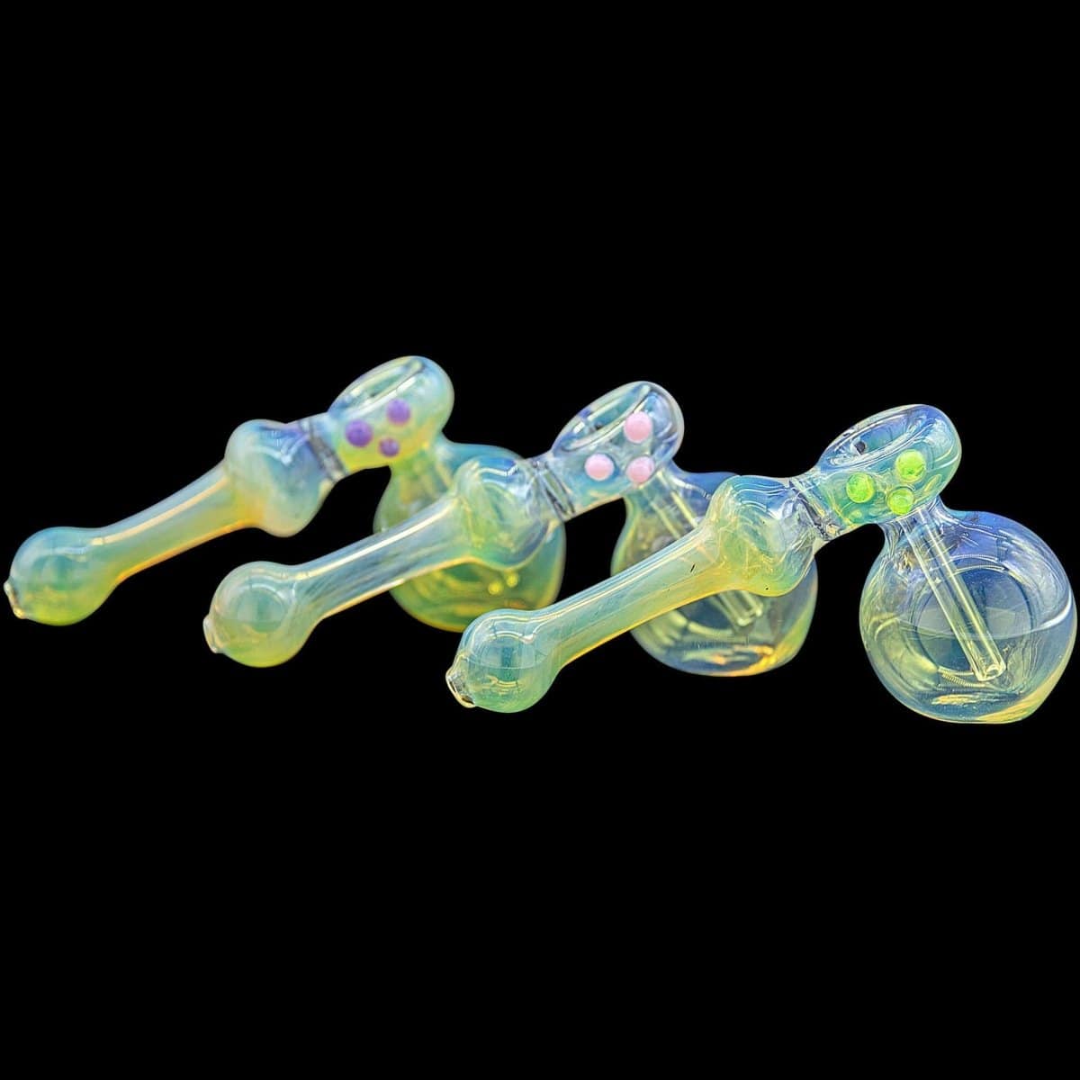 A vibrant, angled view of the “Silver Hammer” Fumed Hammer Bubbler Pipe, showing its colorful glass and curved design against a black background.