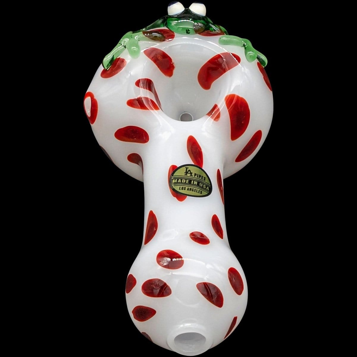 A front view of the “Spotted Poison Frog” Spoon Glass Pipe, showing a colorful, speckled design on clear glass.