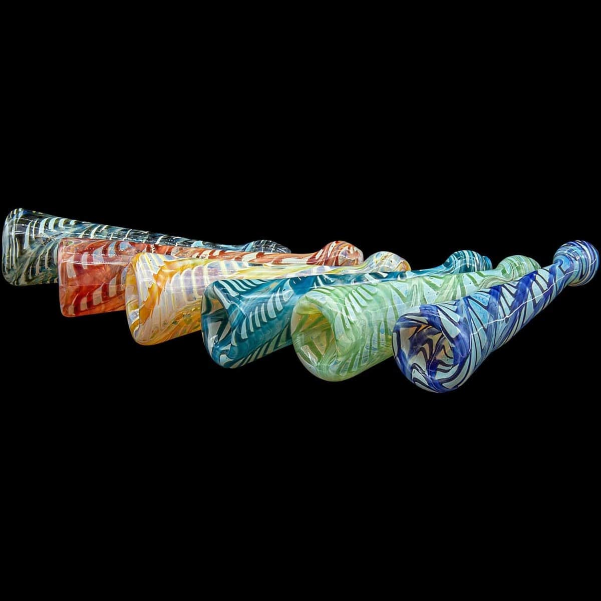 A close-up, angled view of the colorful “Typhoon” Colored Chillum, showcasing its textured glass and compact size against a black background.