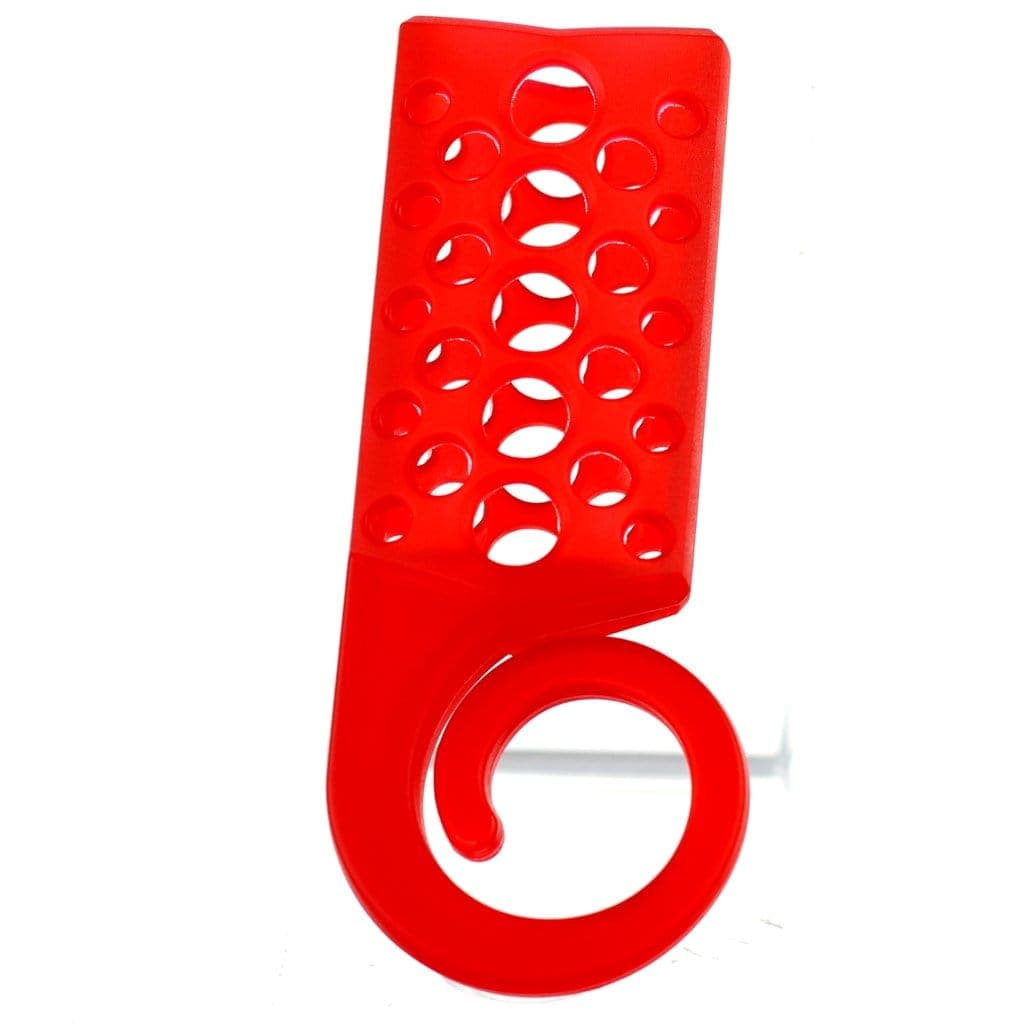 A close-up, angled view of the DHC Originals x Monkey Tail Lighter Holder in red, with circular cutouts along its curved shape.