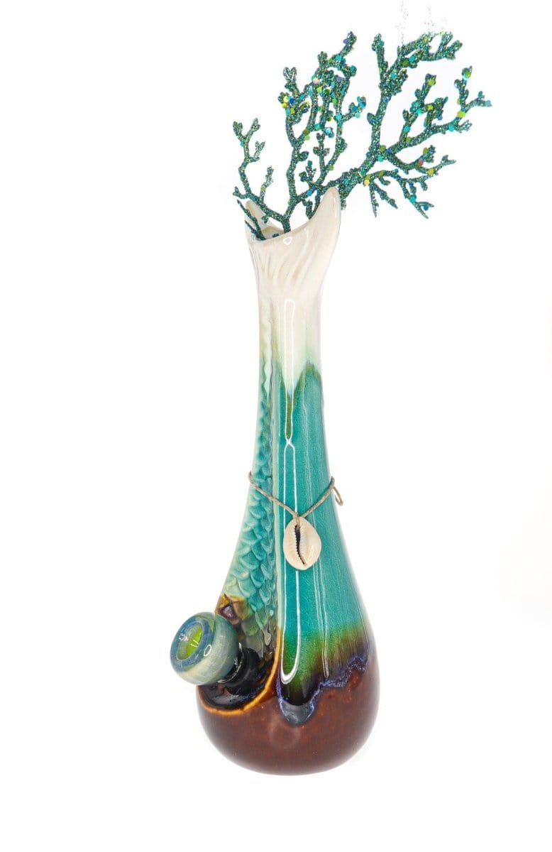 A front view of the My Bud Vase "Mermaid" Water Pipe, showcasing a sculpted glass piece with oceanic blue hues.