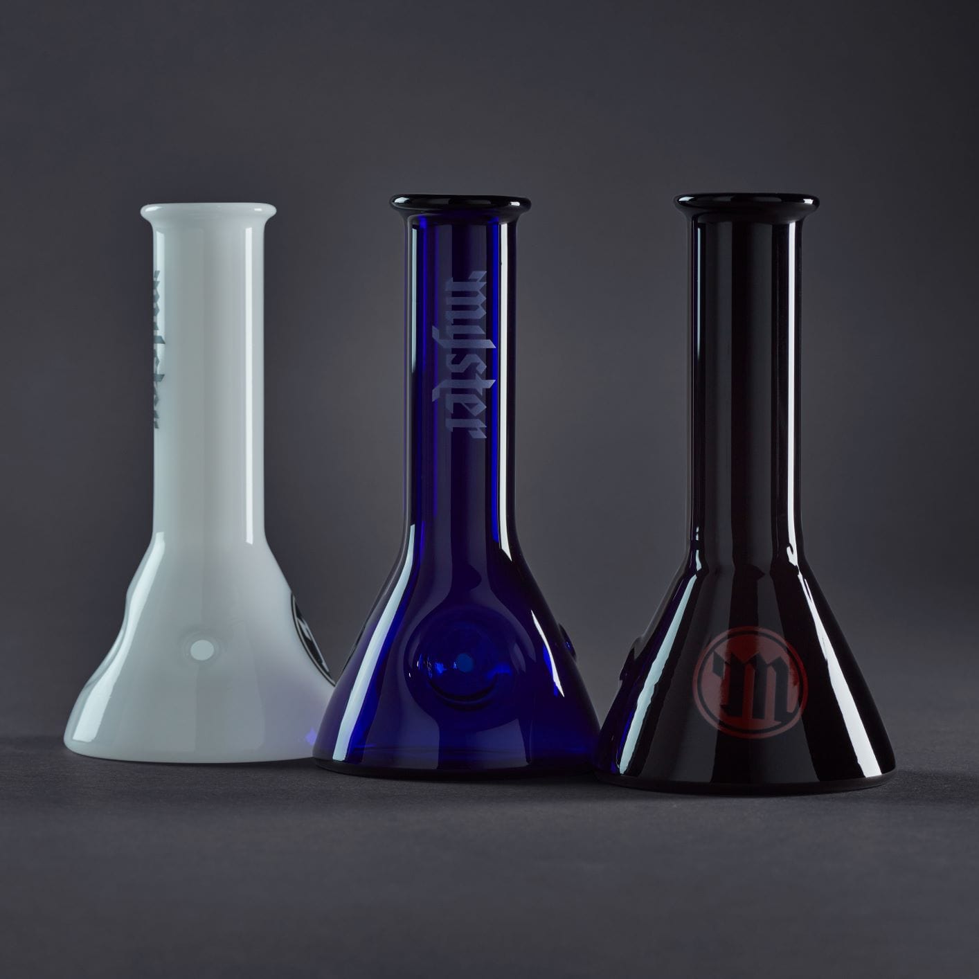 A front view of the Myster Beaker Bowl Glass Pipe, showing two clear glass bowls against a dark backdrop.