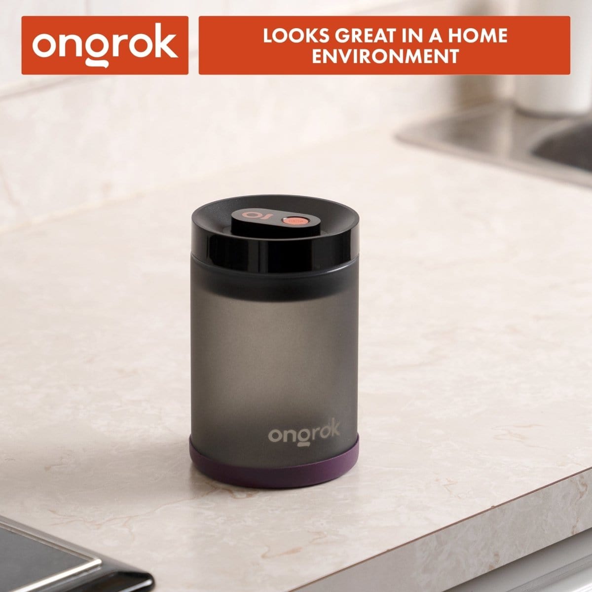 The Onrok Vacuum Pump Jar sits on a marble surface, viewed from a slightly elevated angle.