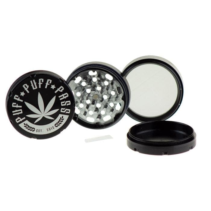 Opened 3 Stage 62mm Aluminum Grinder reveals multiple tiers and a metallic silver finish in a top-down studio shot.