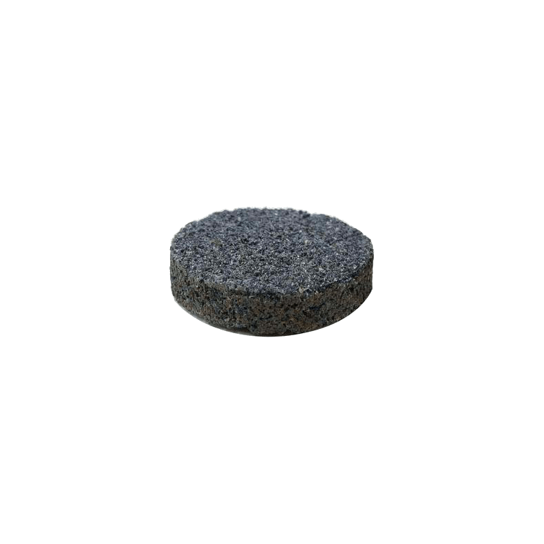 A close-up, top-down view of the PŬK "Magic" Stone with a dark, textured surface.