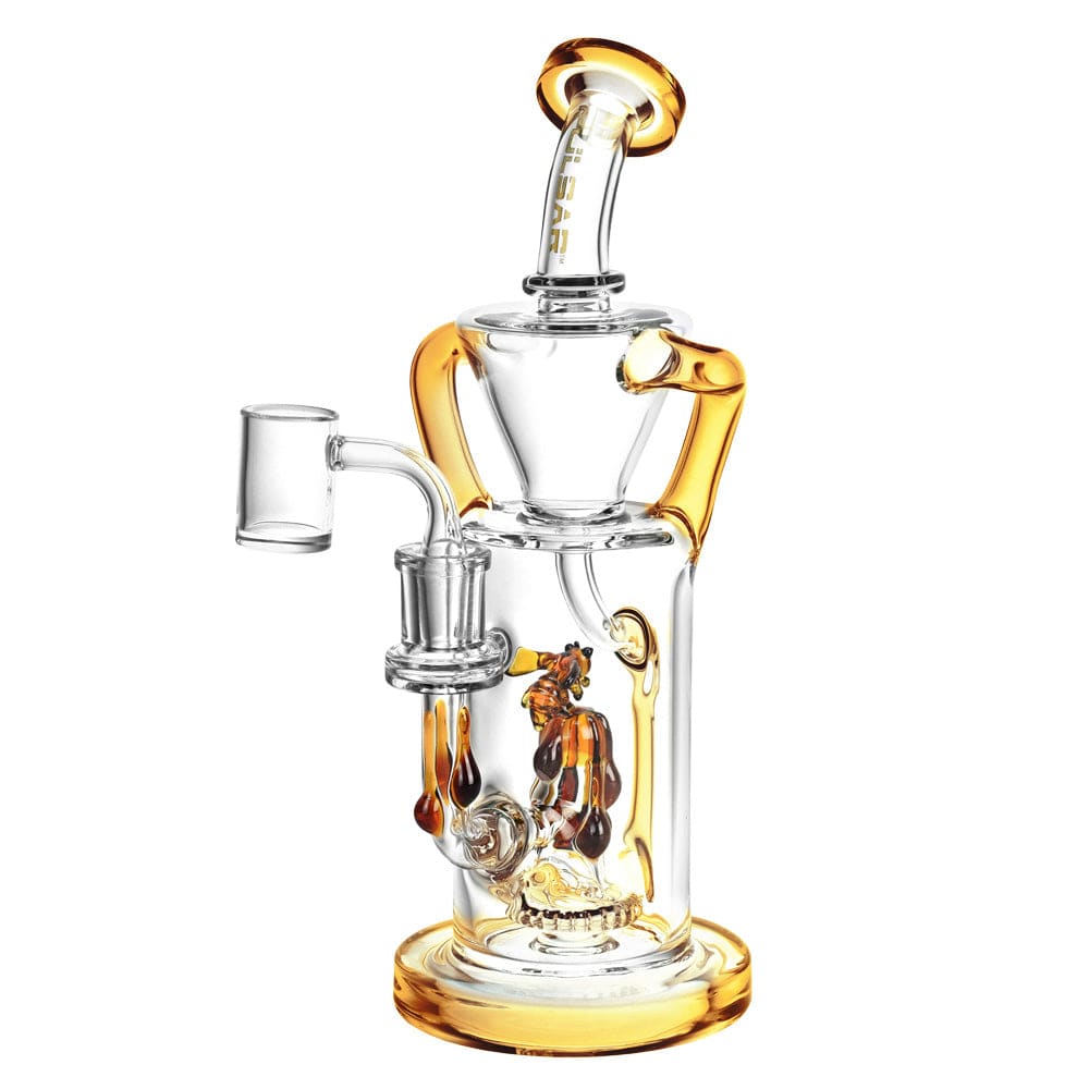 A three-quarter view of the Pulsar Honey Sweetness Recycler Dab Rig, featuring clear glass with amber accents and a unique recycler design.