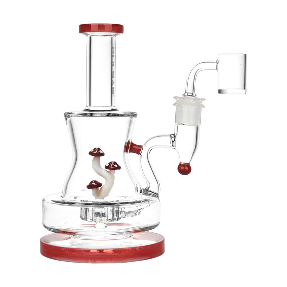 A three-quarter view of the Pulsar Shadow Lurking Shrooms Dab Rig, featuring sculpted mushroom details in clear glass.