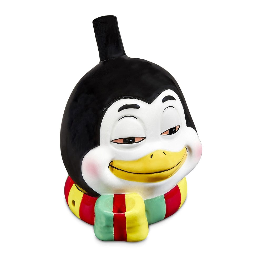 Front view of the colorful Penguin Pipe, a whimsical ceramic piece shaped like a penguin with a red and green base.