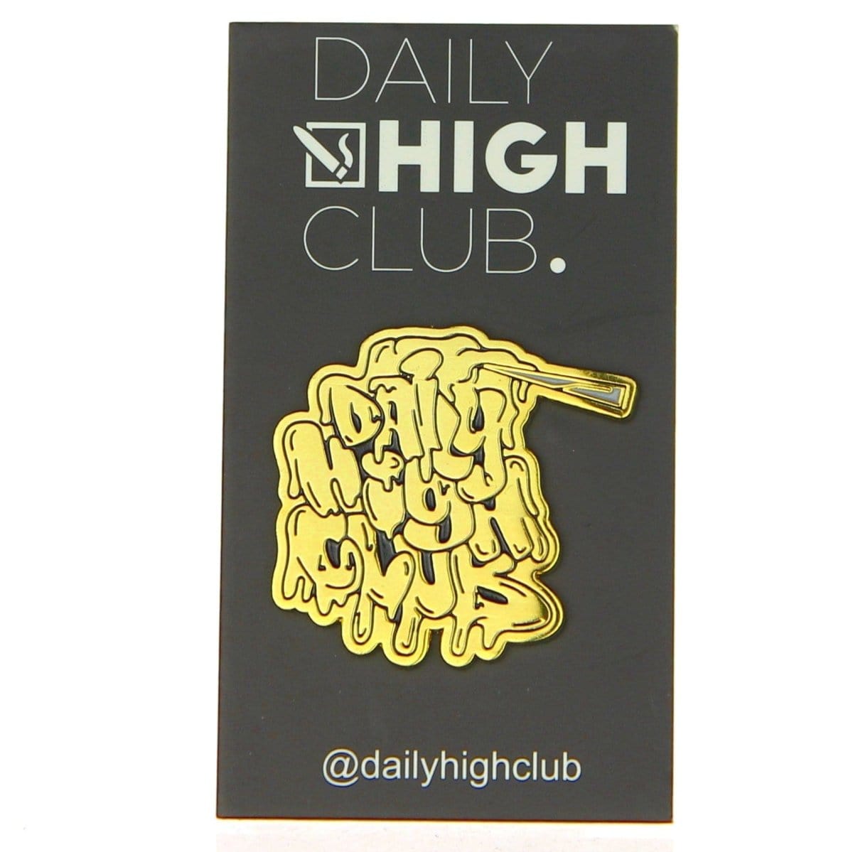 The DHC Originals Dab Slab Enamel Pin is displayed as a close-up shot against a dark background.